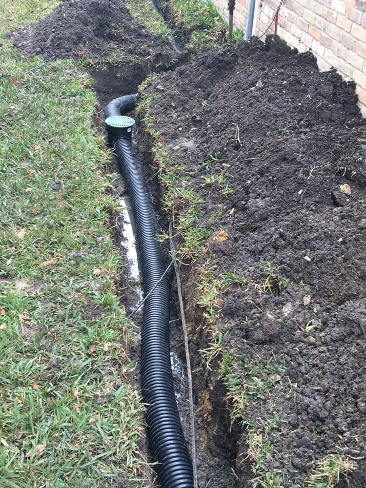 Residential yard drainage line in an open trench